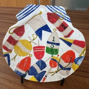 Decoupage nautical motif on natural scallop shell